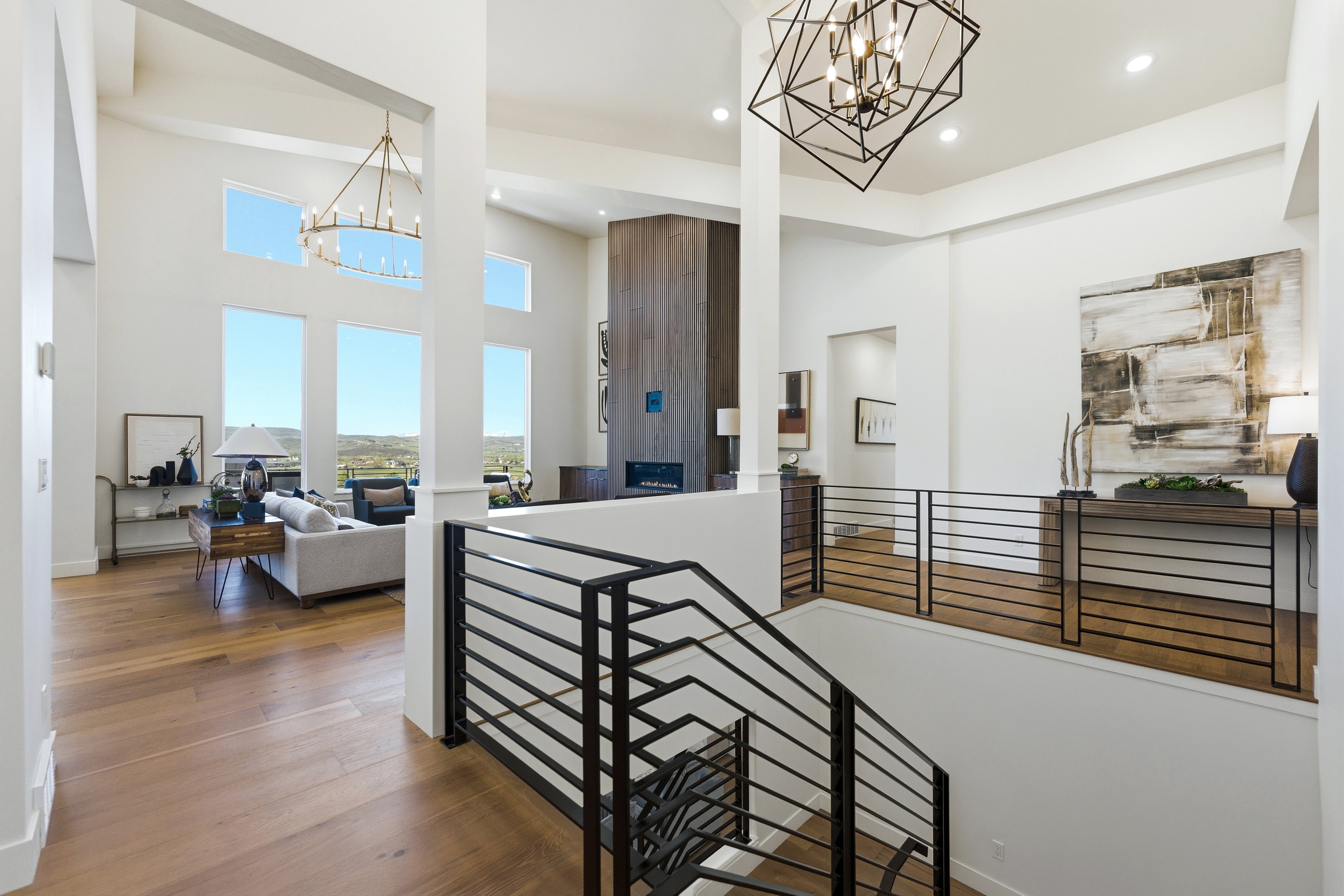 Open-concept interior featuring high ceilings and wood-finish flooring