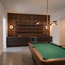 Recreation area featuring a billiard table, a built-in wet bar with dark wood-finish cabinetry, integrated beverage refrigeration, and a tiled countertop. Rendering using AI as home is under construction.