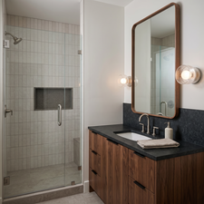 Glass-enclosed shower with a recessed niche and built-in bench. Rendering using AI as home is under construction.