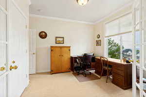 Room featuring a large window, neutral wall paint, and crown molding