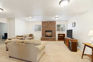 Brick fireplace with a substantial hearth, paired with two horizontal windows featuring white blinds