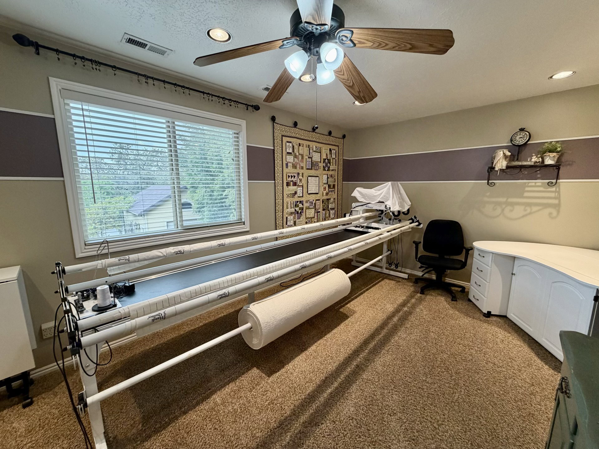 Room featuring a ceiling fan with integrated lighting, recessed lighting, and a large window with blinds