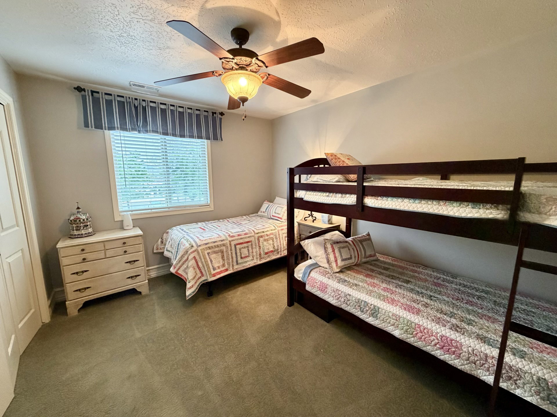 Bedroom featuring light-colored walls and carpet flooring