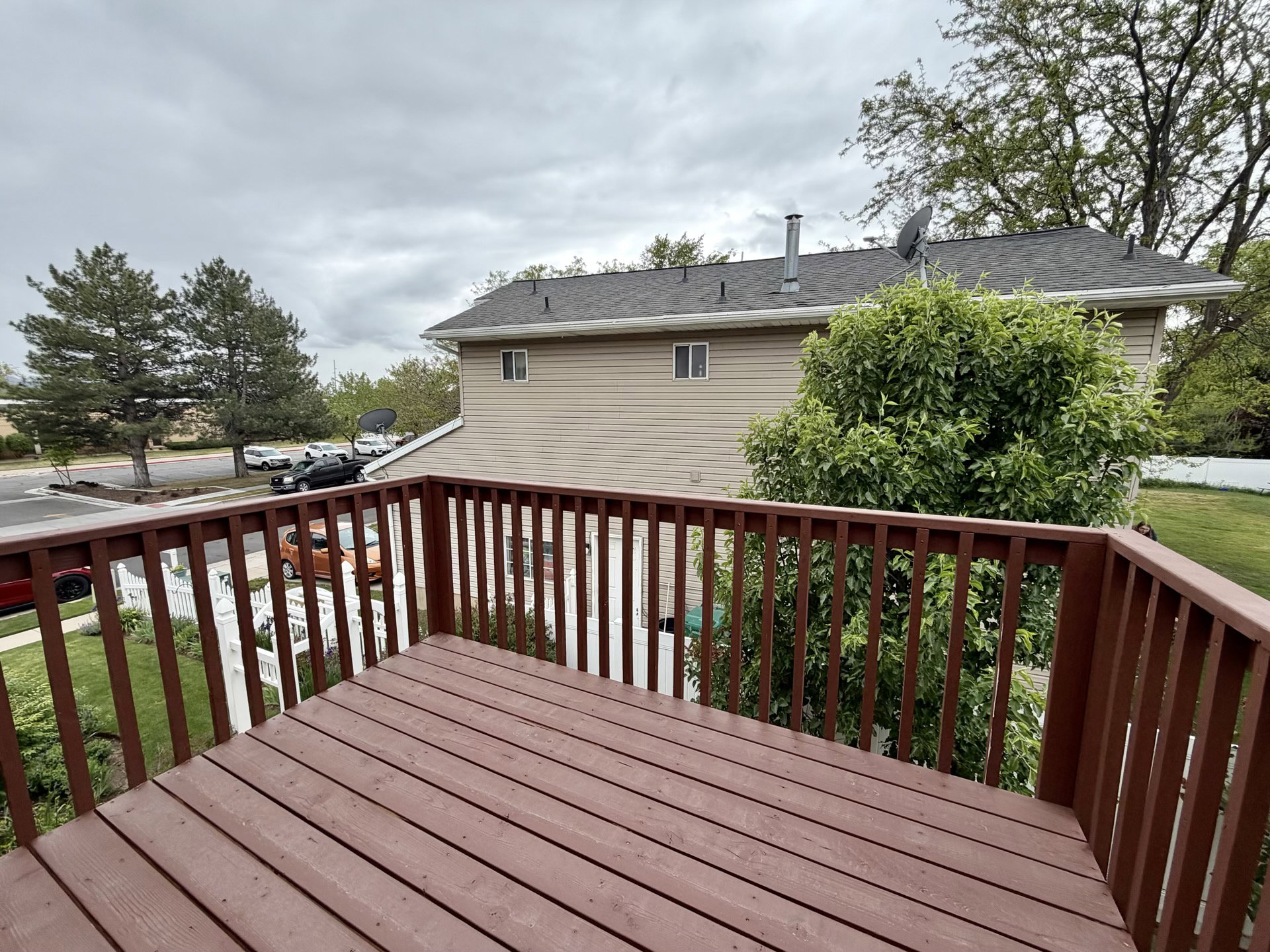 Spacious outdoor deck with wood-finish flooring and sturdy railings