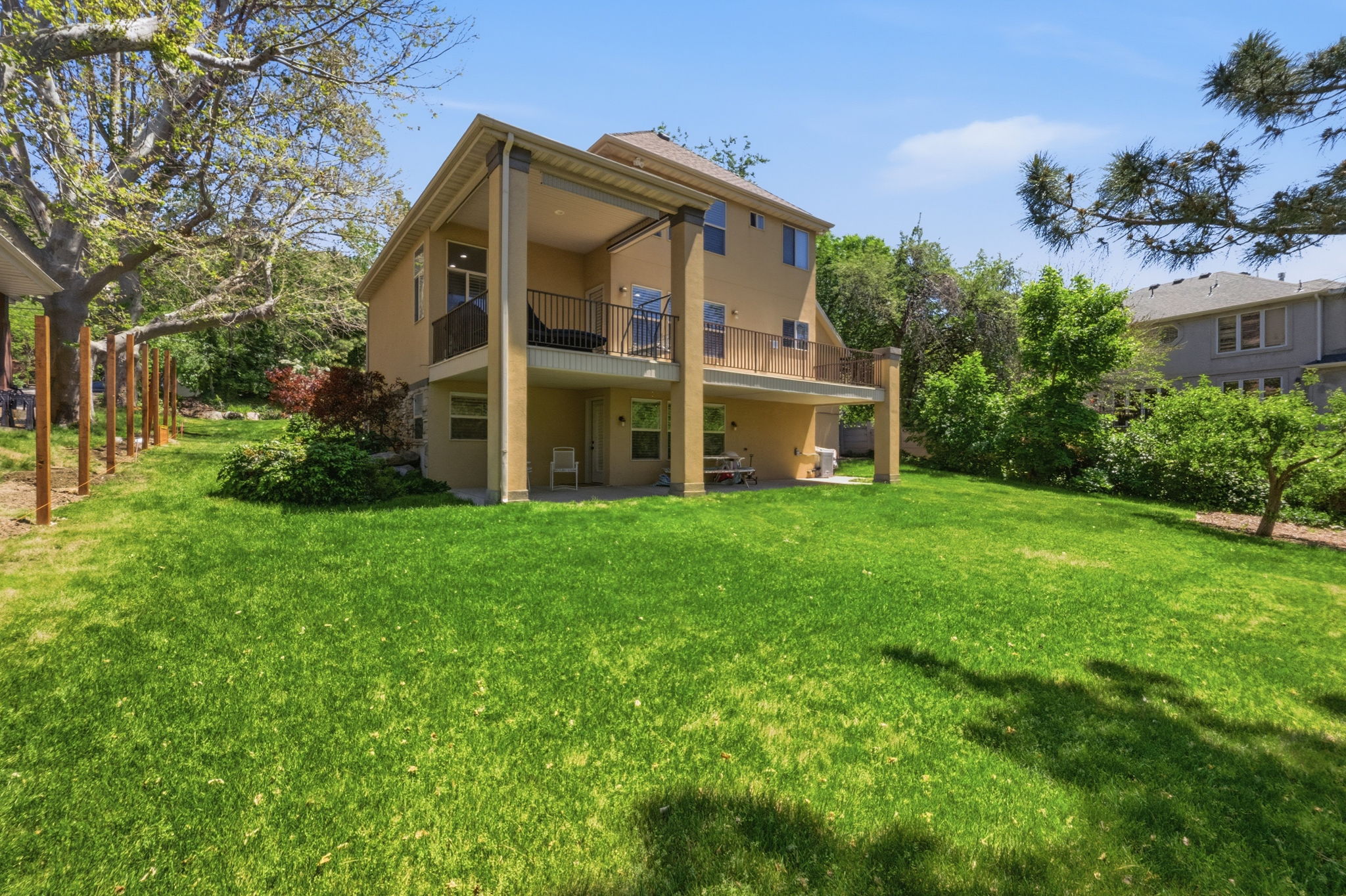 Spacious rear lawn with mature perimeter trees
