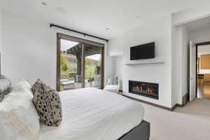 Contemporary gas fireplace integrated into a white wall