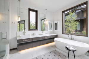 Freestanding soaking tub with a large window