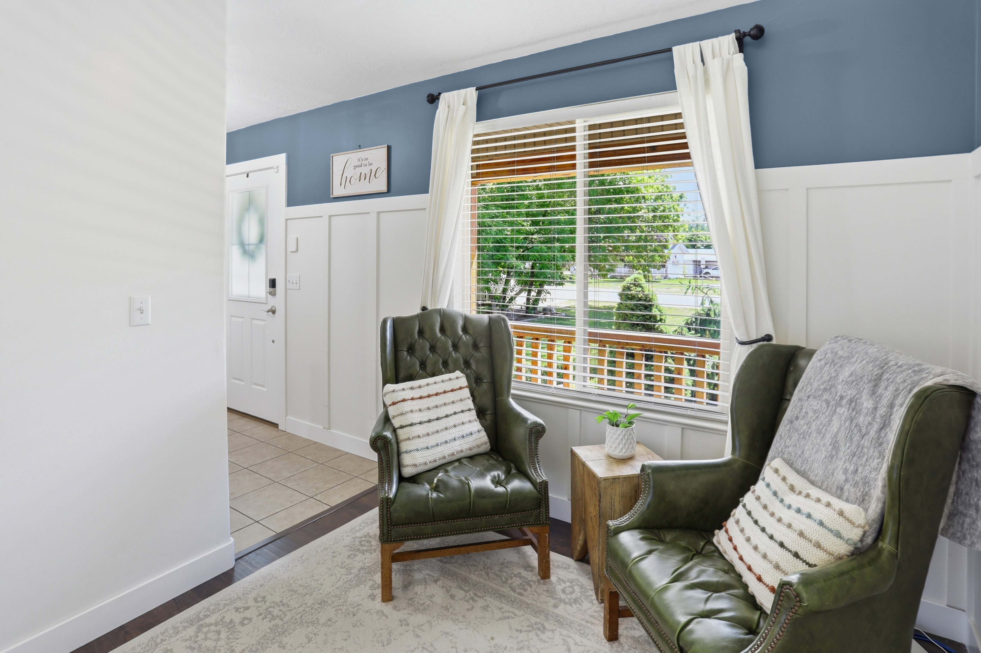 Board and batten accent wall with a contrasting blue upper wall
