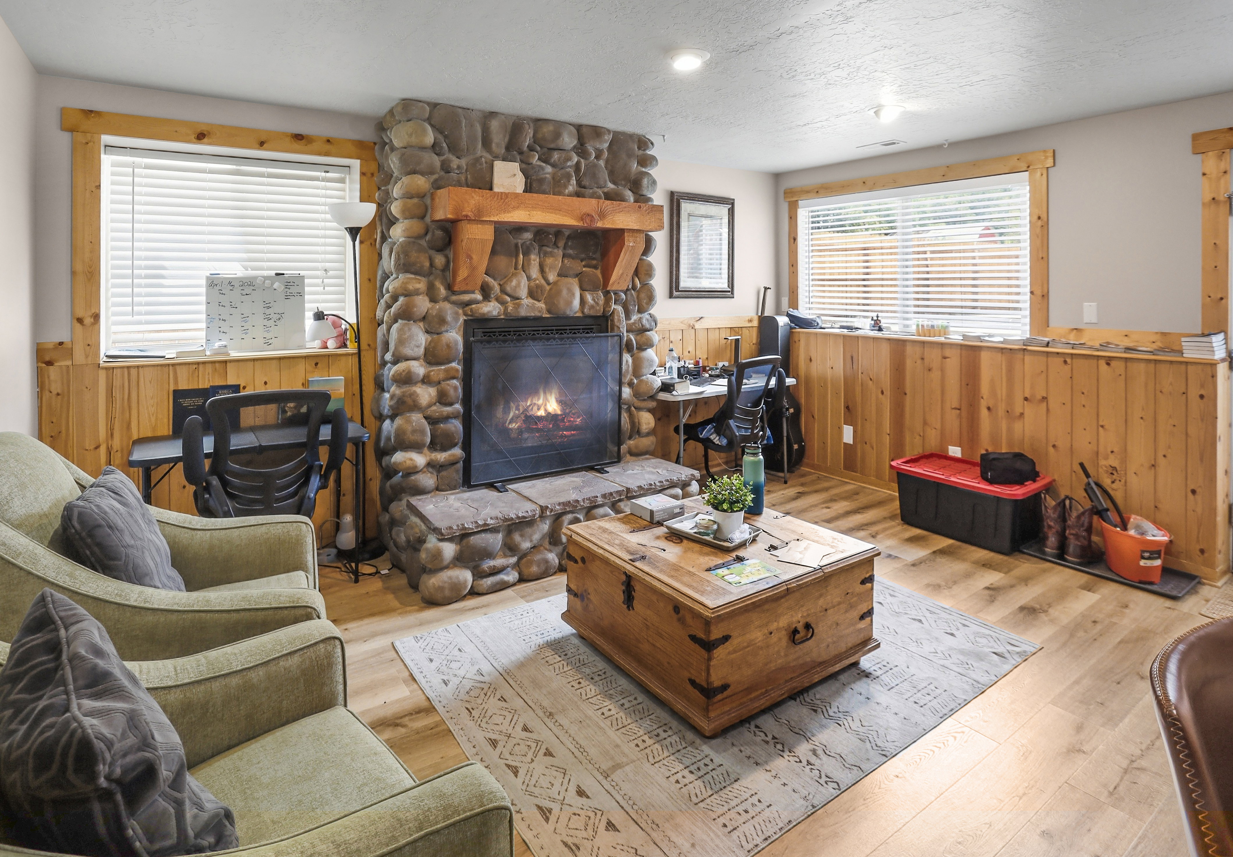 Stone-clad fireplace with a wood mantel