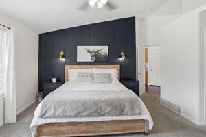Accent wall featuring vertical paneling in master bedroom