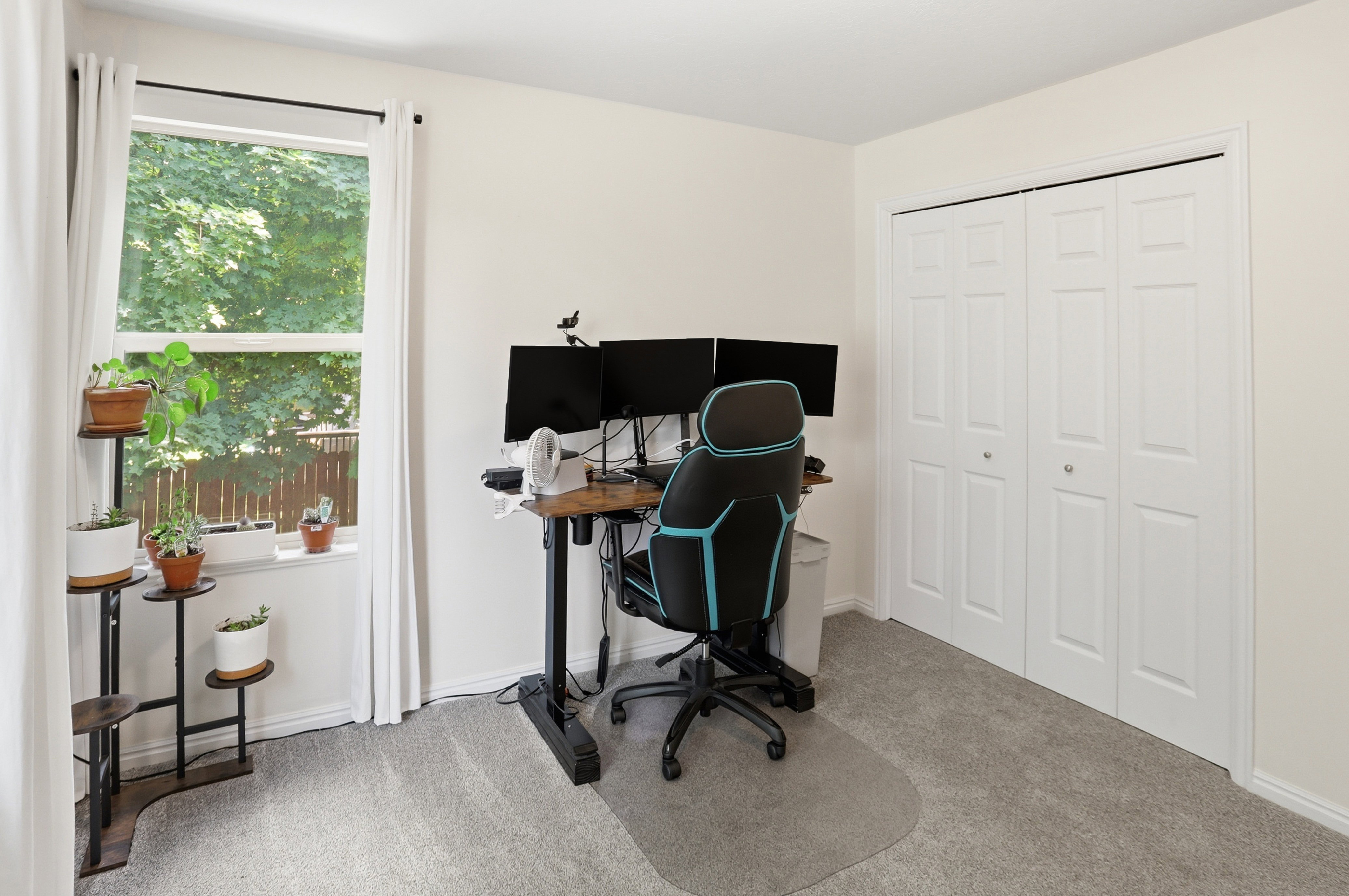 Room with light gray carpeting and neutral wall paint