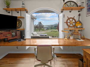 Arch-top window with operable louvered shutters