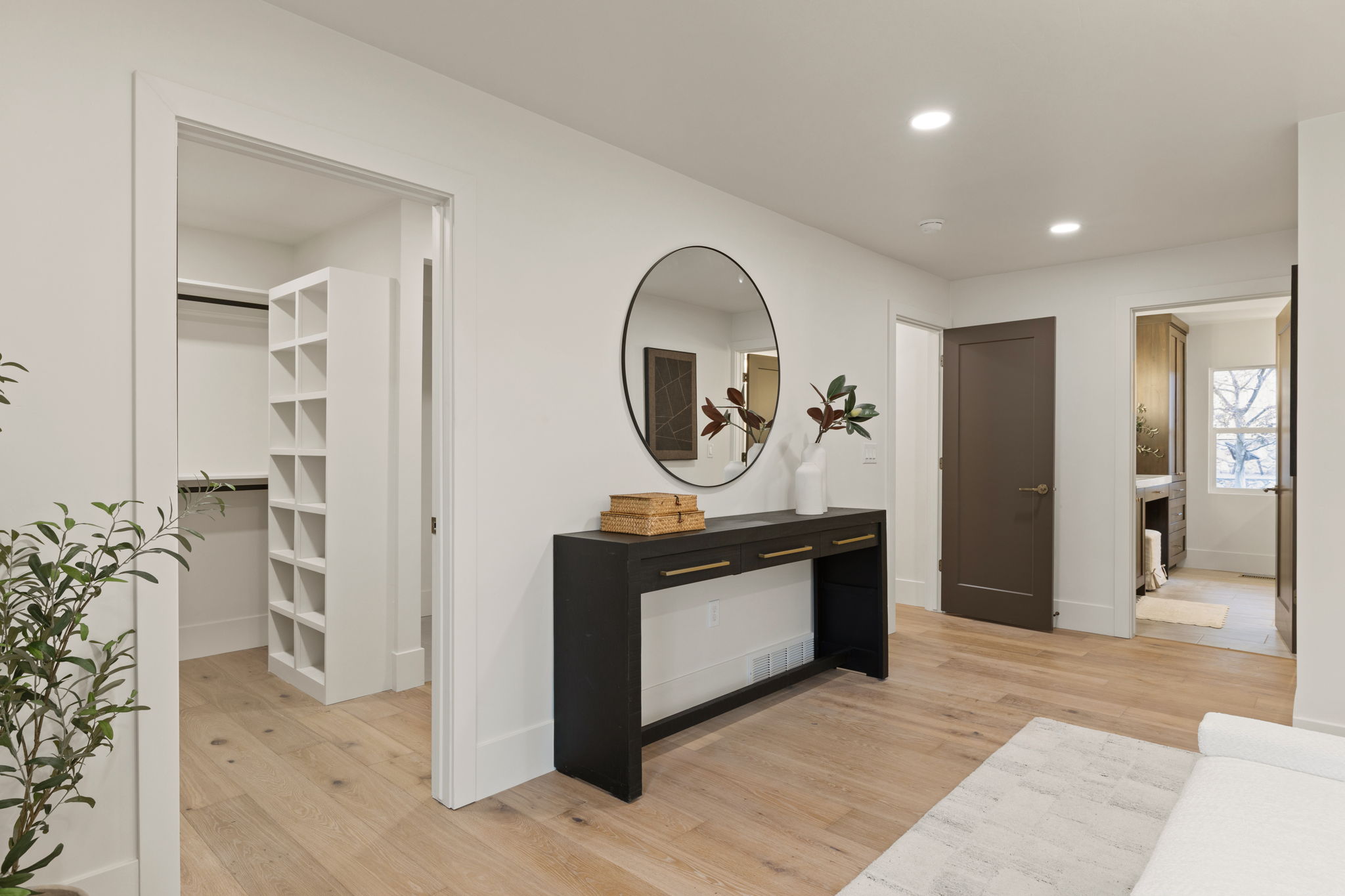Entryway featuring light wood-finish flooring and recessed lighting