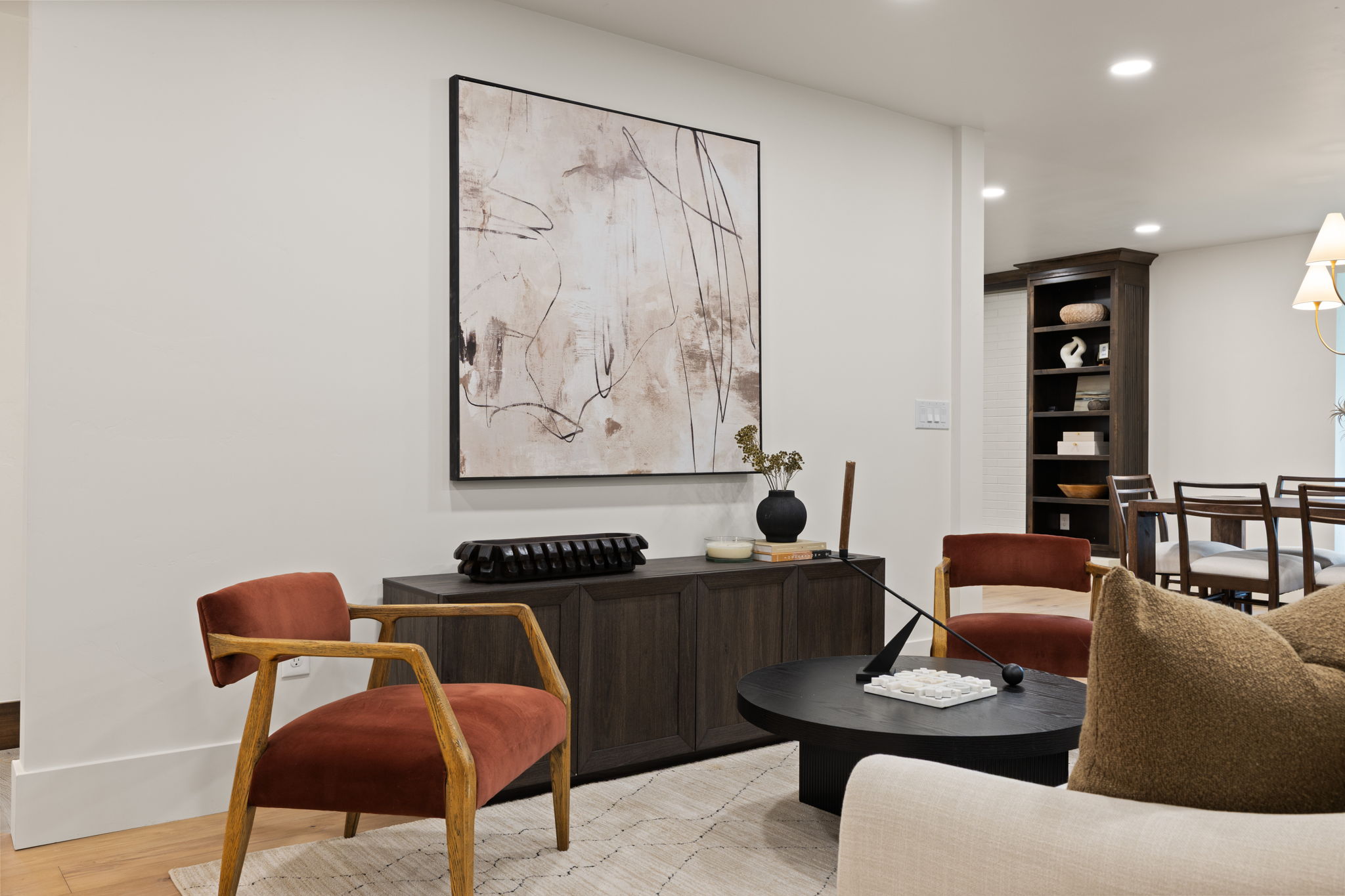 Open-concept living space with light wood-finish flooring