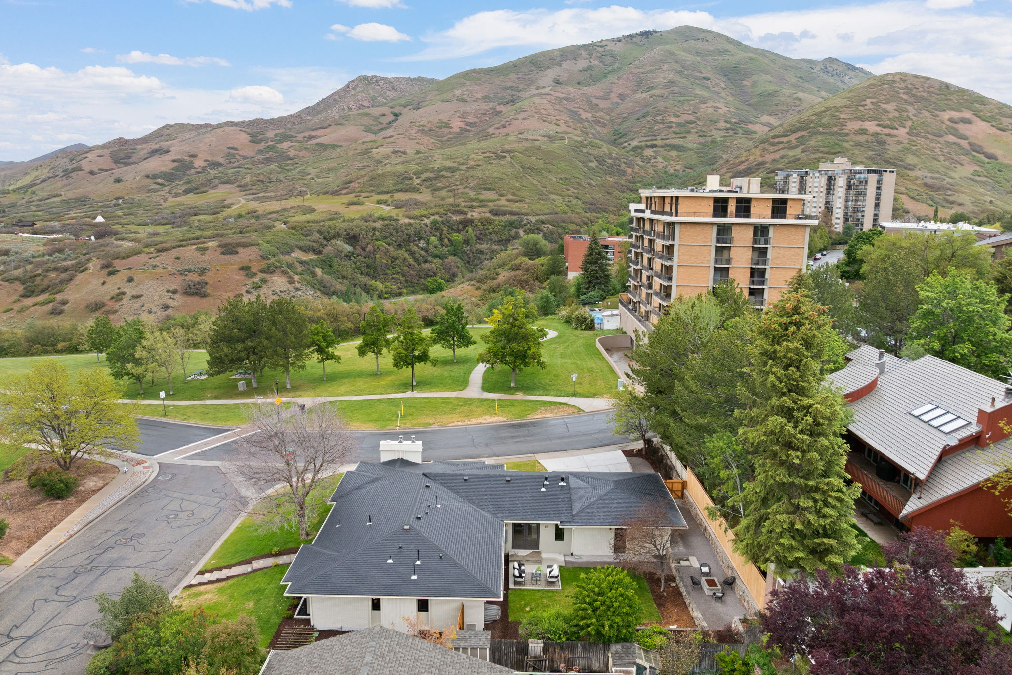 Expansive mountain backdrop with surrounding green spaces