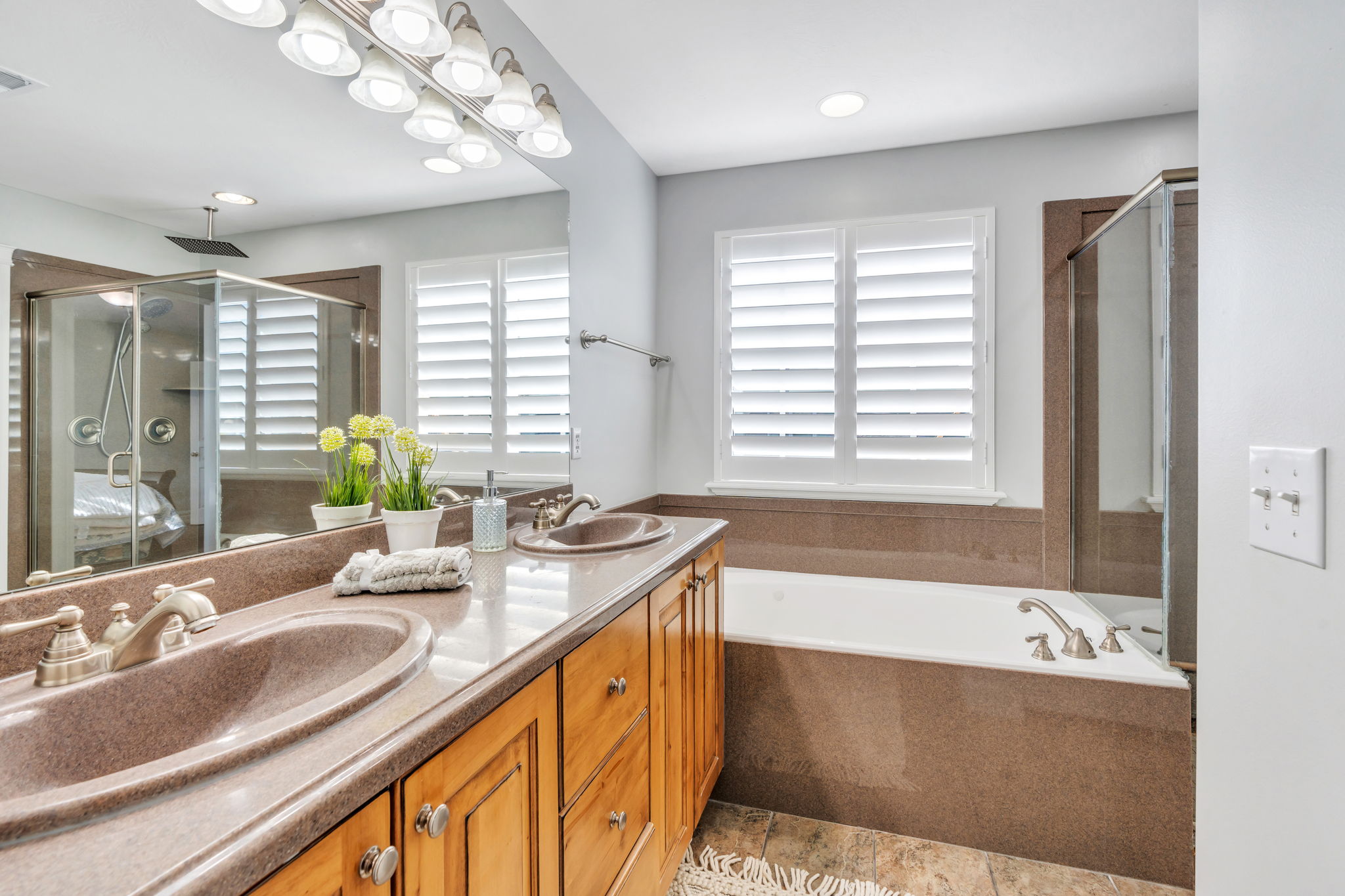 En suite bathroom with double vanity, and jetted tub