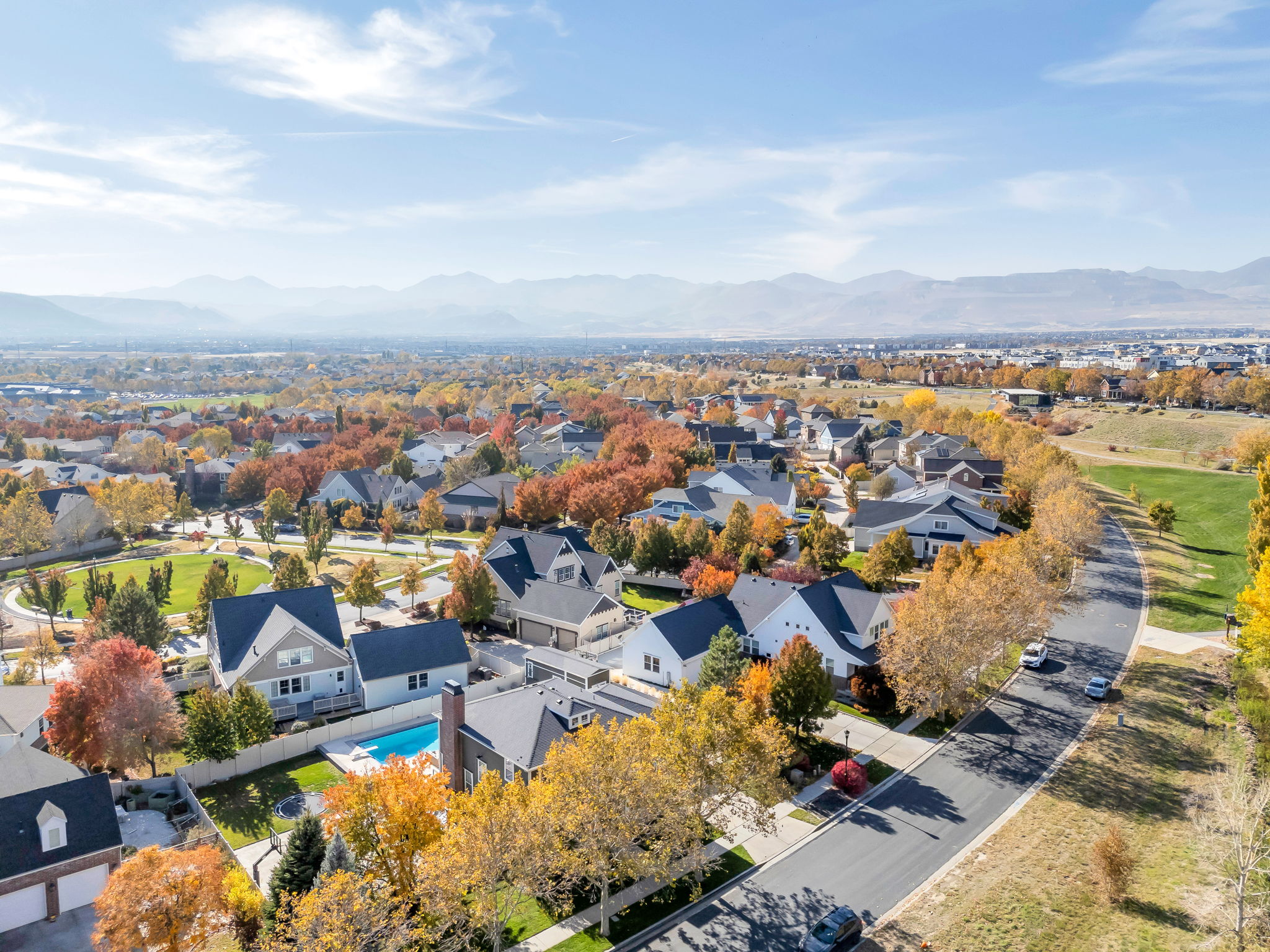 Aerial perspective of suburban area with a mountainous background