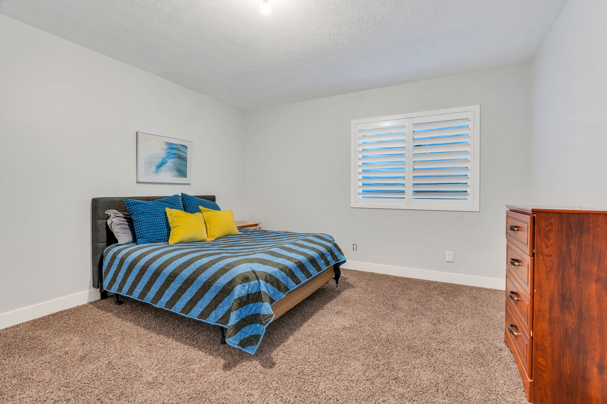 Basement carpeted bedroom