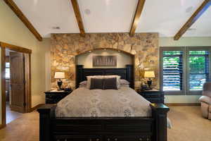 Stone accent wall with an arched alcove featuring recessed lighting