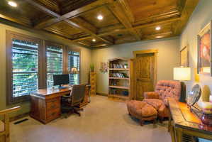 Coffered wood ceiling featuring recessed lighting
