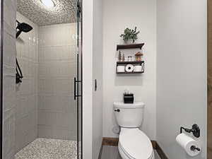 Walk-in shower with pebble tile floor and ceiling