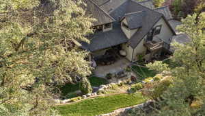 Terraced landscaping with manicured lawns and mature trees