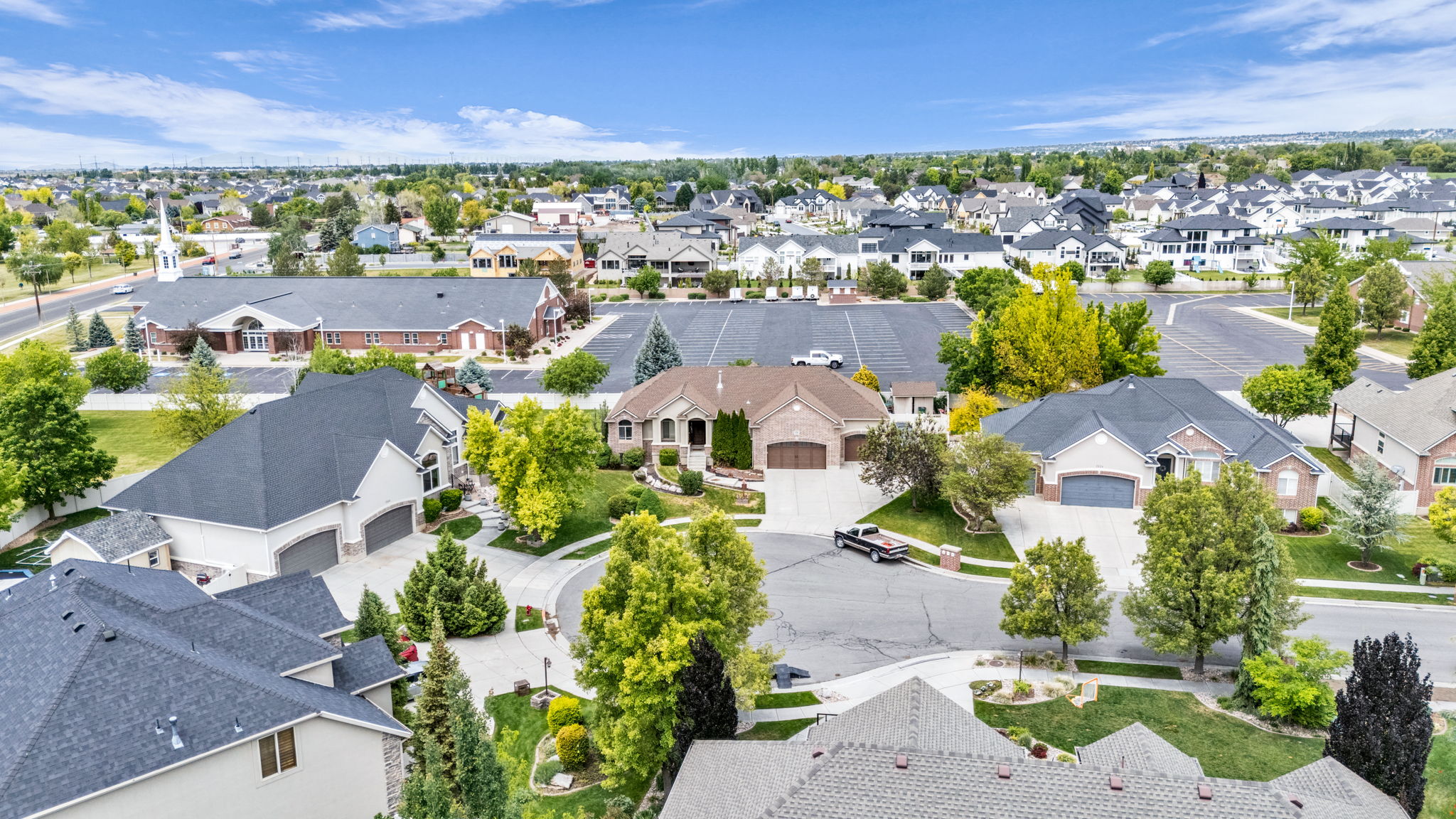 Residential neighborhood featuring mature trees and a curvilinear street plan
