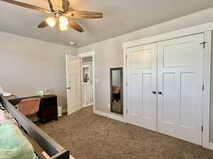Spacious room featuring neutral paint tones and warm-toned carpet flooring