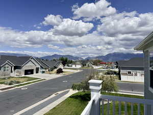 Mountain backdrop with residential architecture featuring varied siding and rooflines