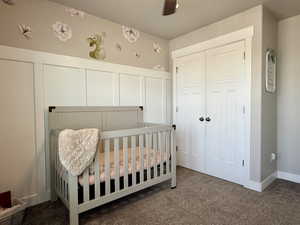 Room featuring board and batten wall detailing, neutral paint, and plush carpeting