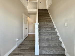 Foyer with wood-finish flooring extending into a hallway