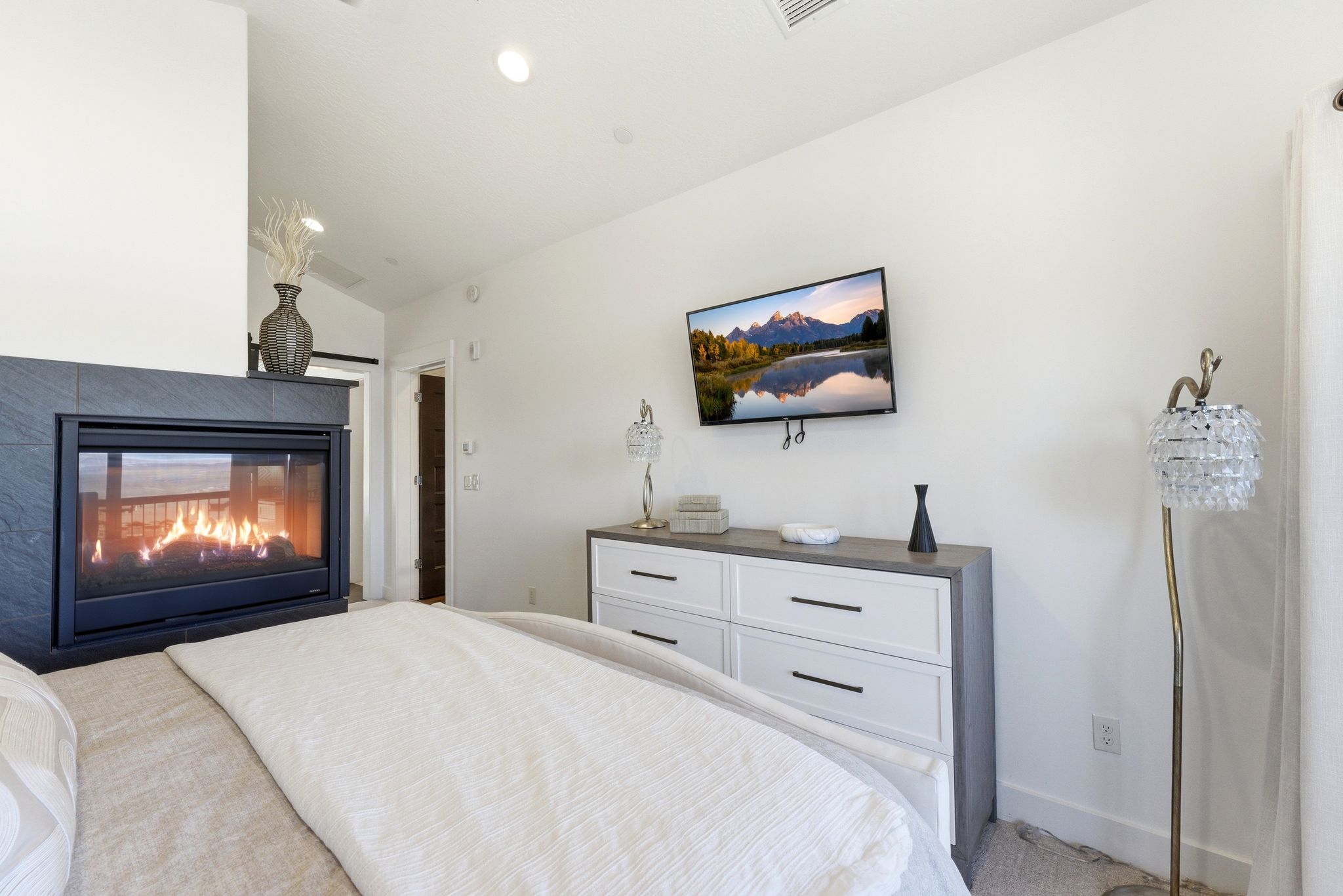 Built-in fireplace with a dark tile surround and hearth