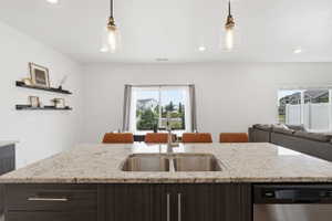 Kitchen island with a double basin stainless steel sink and a stainless steel faucet