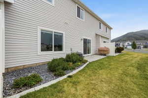 Rear exterior featuring light-toned horizontal siding