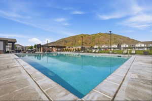 Rectangular swimming pool surrounded by a concrete deck