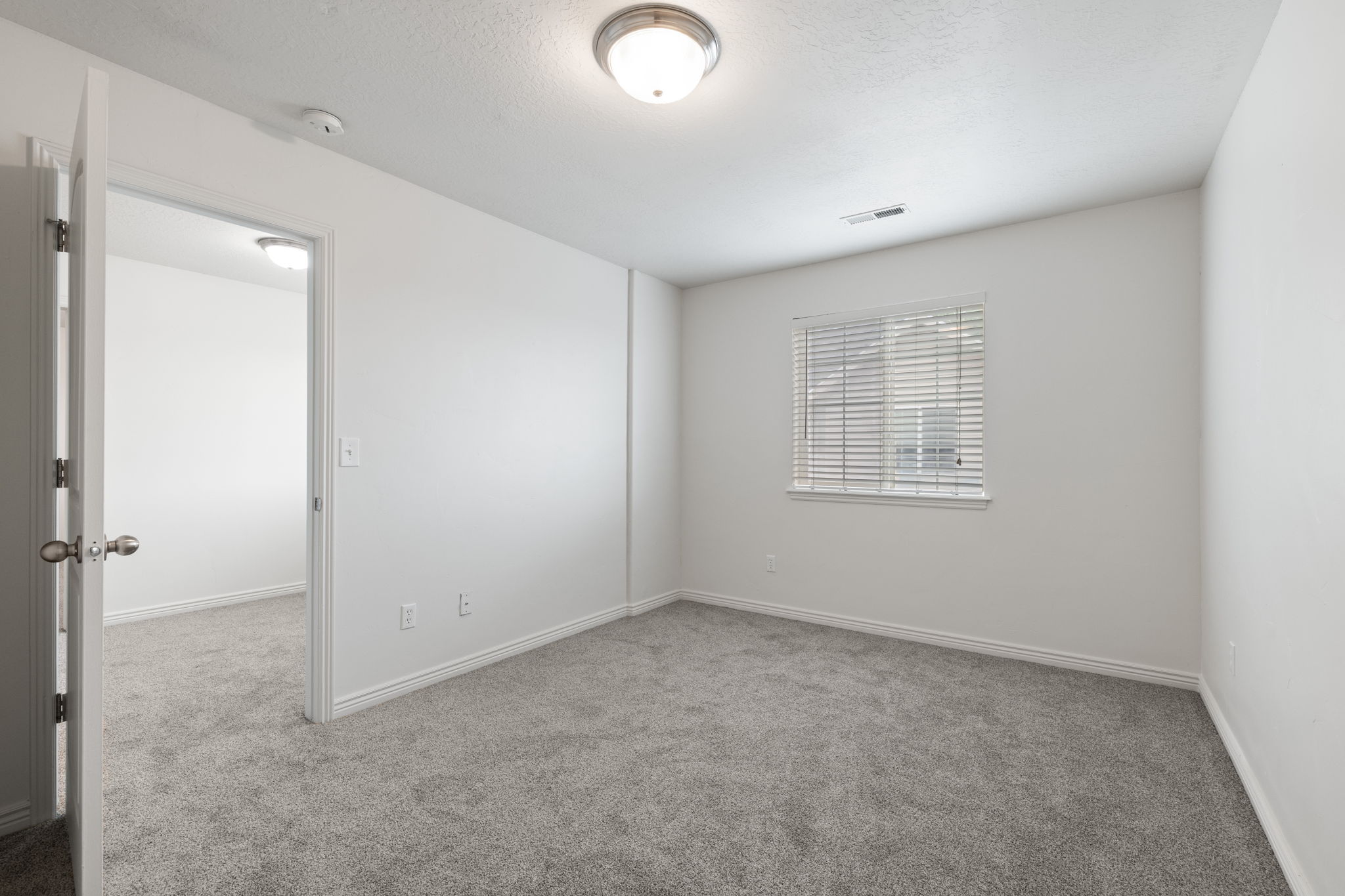 Spare bedroom with new carpet and fresh paint