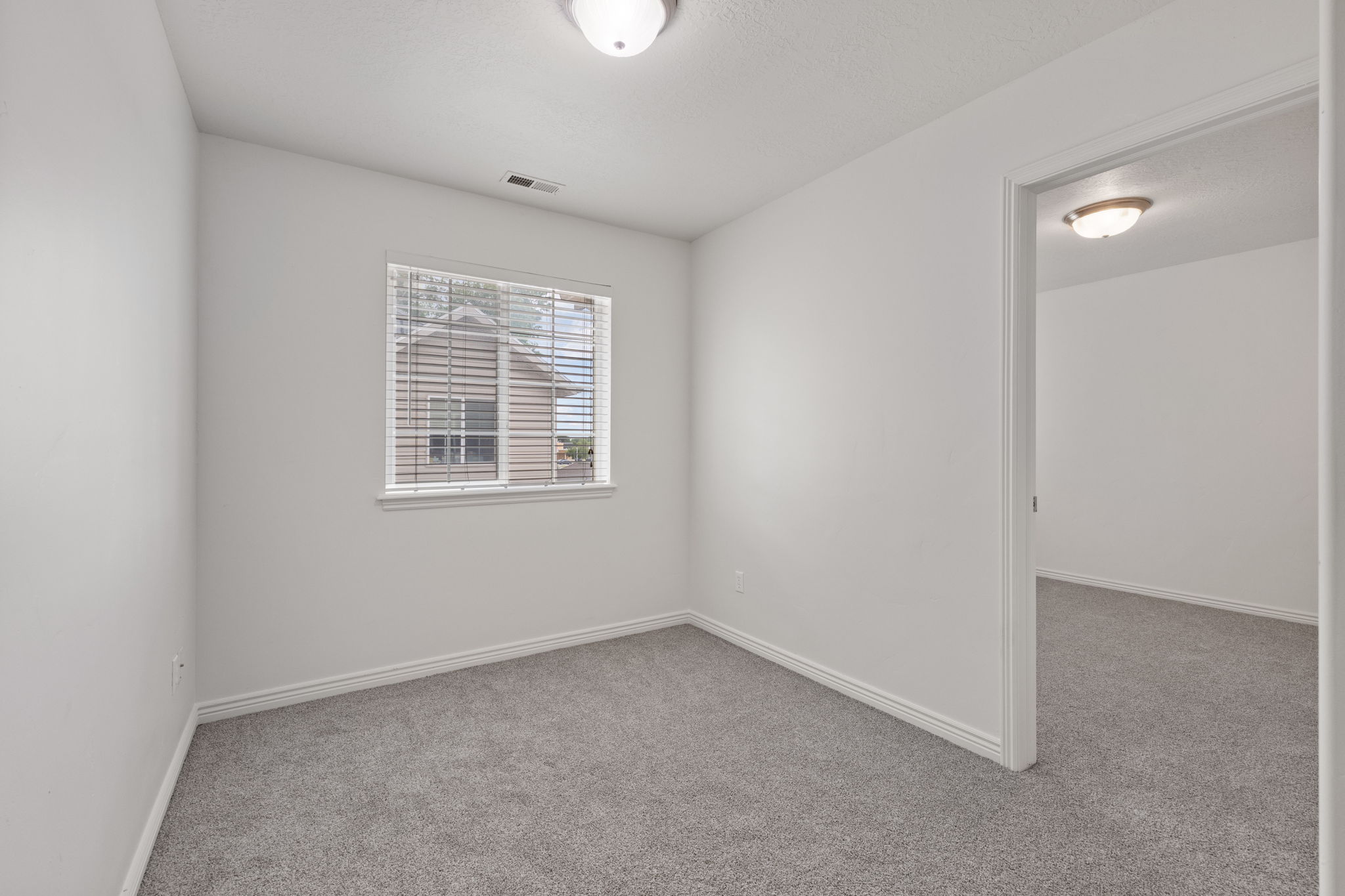 2nd floor bonus space featuring new carpet and light neutral paint