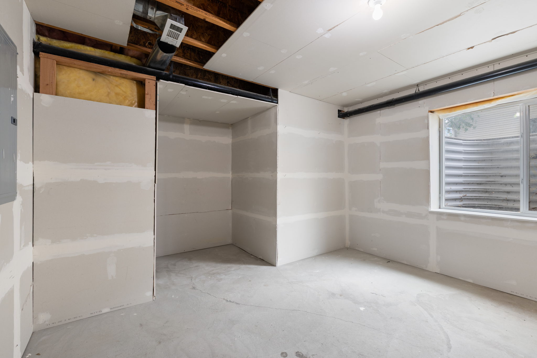 Unfinished basement space for future fourth bedroom