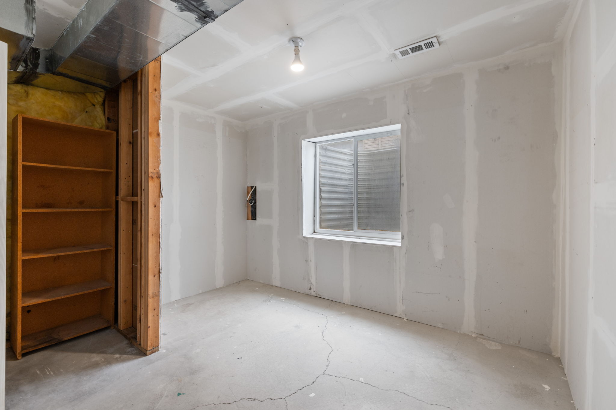 Unfinished basement space for future fourth bedroom