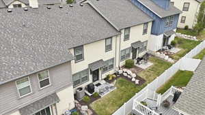 Rear exteriors featuring private fenced yards with concrete patios and mature landscaping