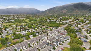 Aerial perspective showcasing a residential community with varied architectural styles and mature landscaping