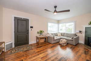 Warm hardwood flooring complements the neutral wall tones
