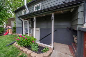 Exterior siding in a two-tone finish with dark gutters
