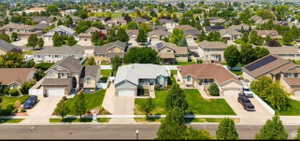 Aerial overview highlighting residential properties with varied architectural styles and mature landscaping
