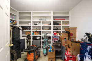 Built-in shelving units provide extensive storage capacity within this dedicated space