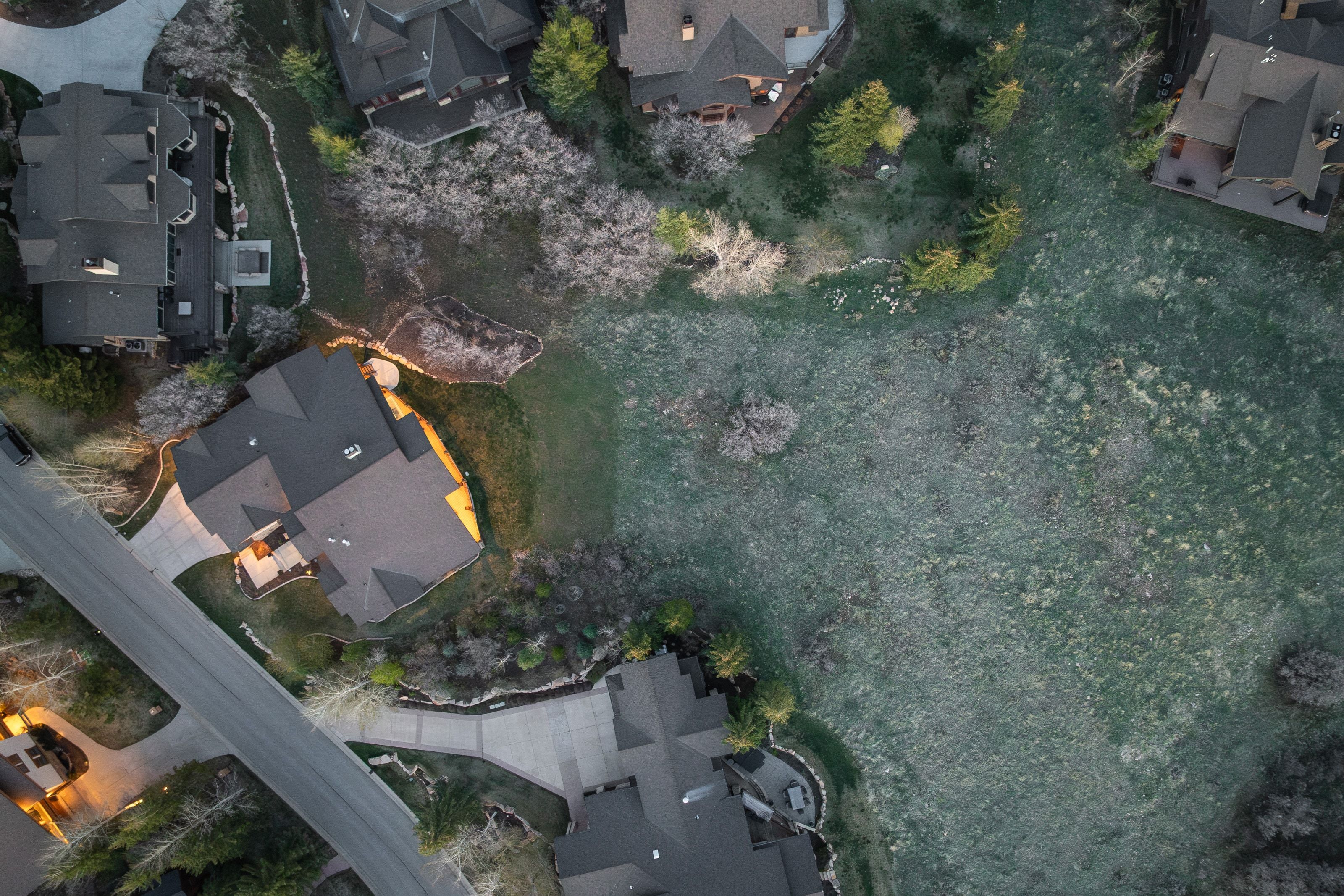 Aerial view of property's location featuring nearby suburban area
