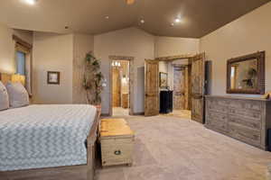 Bedroom with lofted ceiling, light carpet, a ceiling fan, and recessed lighting