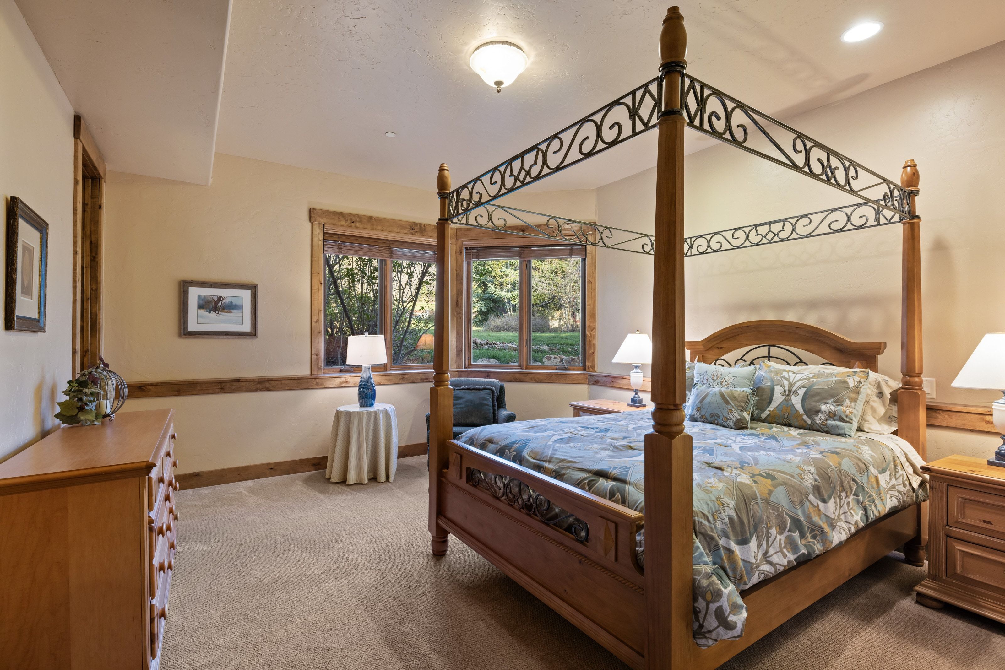 Carpeted bedroom featuring baseboards