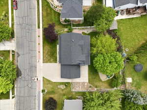 Large lot features dedicated garden areas, full auto sprinkler systems, secondary water, fully fenced, four fruit trees including pear, plum, and two peach trees, mature landscaping