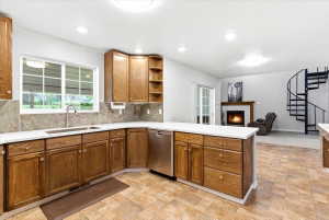 Quartz countertops, stainless steel appliances, abundant storage space and modern canned lighting